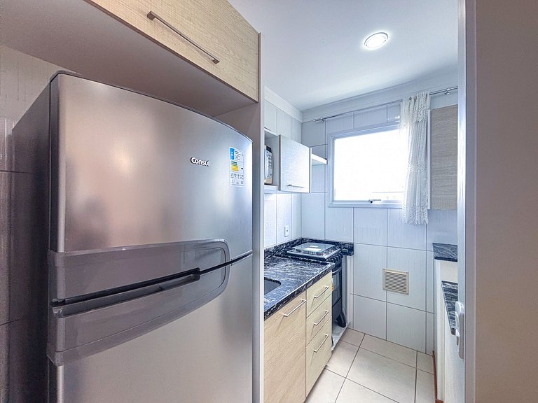 Apê com A/C e Garagem | 300m Praia de Canasvieiras