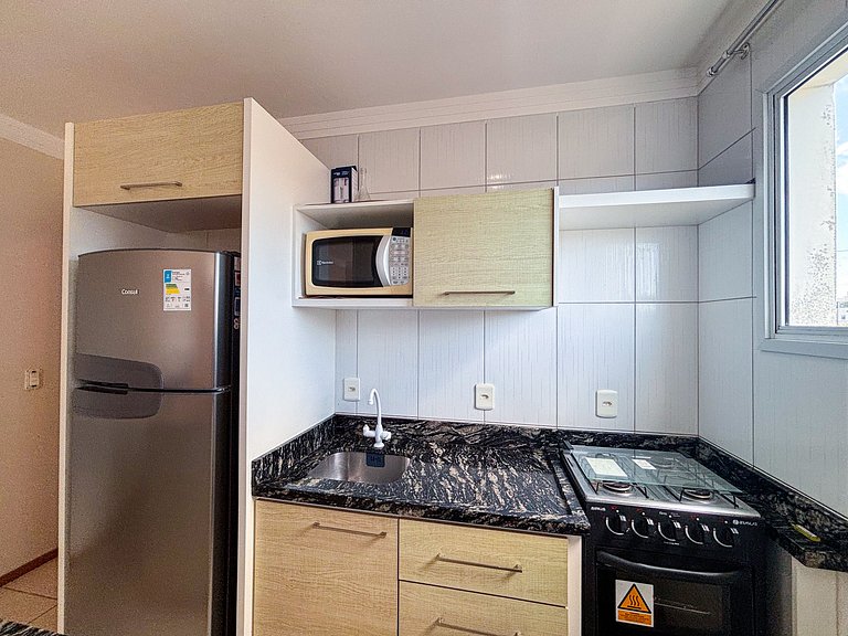 Apê com A/C e Garagem | 300m Praia de Canasvieiras